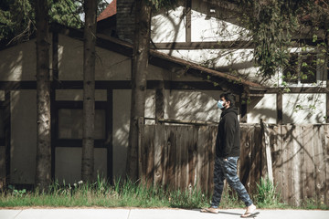 man with mask alone in a street