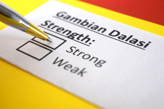 One person is answering question about strength of Gambian Dalasi.
