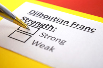 Fototapeta premium One person is answering question about strength of Djiboutian Franc.