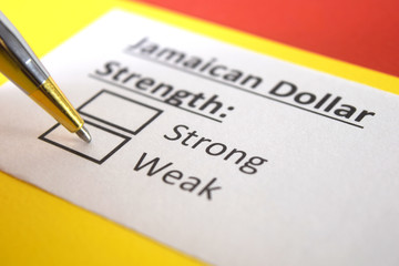 One person is answering question about strength of Jamaican Dollar.