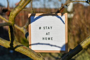Stay at home' words on lightbox. Safety concept.