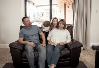 COVID-19 Lockdown. Overwhelmed Parents struggling with stressed kids at home in quarantine