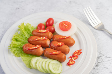 Sausage placed on a white plate.