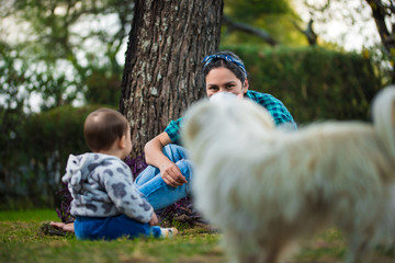 Mother and son with chinstrap. Coronavirus. Mom and kid love. Baby and his mom in the park. mommy and son playing at home. Cover mouth.