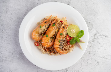 Mama and shrimp on a white plate.