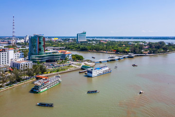 Fototapeta na wymiar Top view aerial view Love bridge or Ninh Kieu wark bridge Can Tho City, Vietnam with development buildings, transportation, energy power infrastructure.