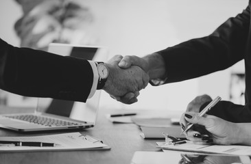 Business people shaking hands together