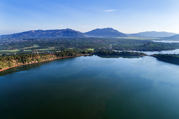 Aerial view of  To Nung lake or T’nung lake near  Pleiku city, Gia Lai province, Vietnam. To Nung lake or T’nung lake on the lava background of a volcano that has stopped working