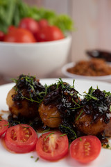 Boiled eggs stir-fried with tamarind sauce.