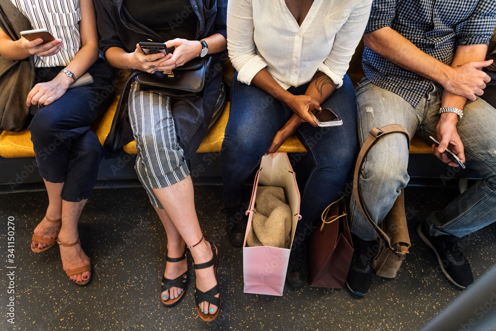 Wall mural group of diverse people riding a train