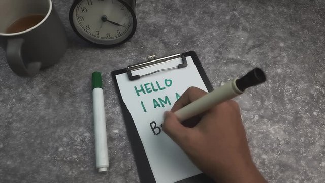 A young man writen Hello I Am a Beta Tester. 4k Resolution
