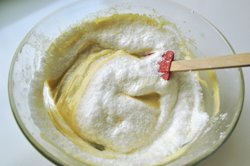 Recipe sequence - mini fruit sponge cakes - baking preparation.  Mixing eggs, yolks, flour and...