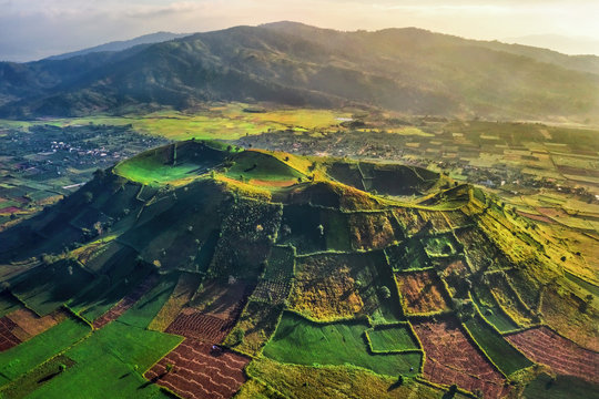 Aerial view of  Chu Dang Ya volcano mountain with Da Quy flower or Tithonia diversifolia flower  near Pleiku city, Gia Lai province, Vietnam. Chu Dang Ya mountain is a volcano that has stopped working