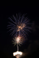 Blue and white fireworks in the sky with copy space