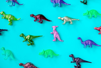 Various animal toy figures in a colorful background