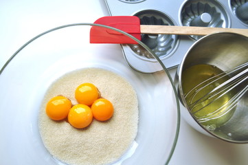 Recipe sequence - mini fruit sponge cakes - baking preparation.  Mixing eggs, yolks, flour and...