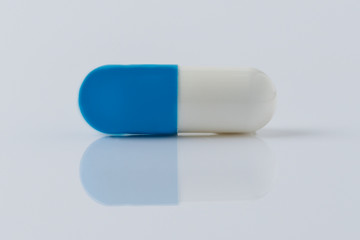 Pill for viral disease on a white background