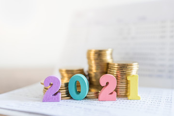 2021 New year, Business, Saving and Planning Concept. Close up of colorful wooden number on bank...