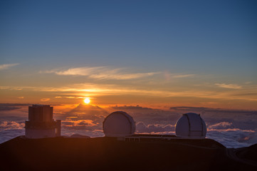 Sunset and telescopes at the top of the Mauna Kea volcano.