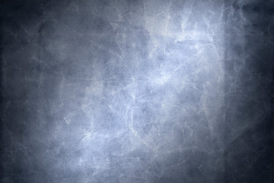 Blue scratched textured paper background