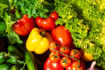 Fresh vegetables on the table. Preparation of vegetable salad. Greek salad. Vegetarianism. A raw food diet. Natural vitamins and trace elements. Vegetable shop.