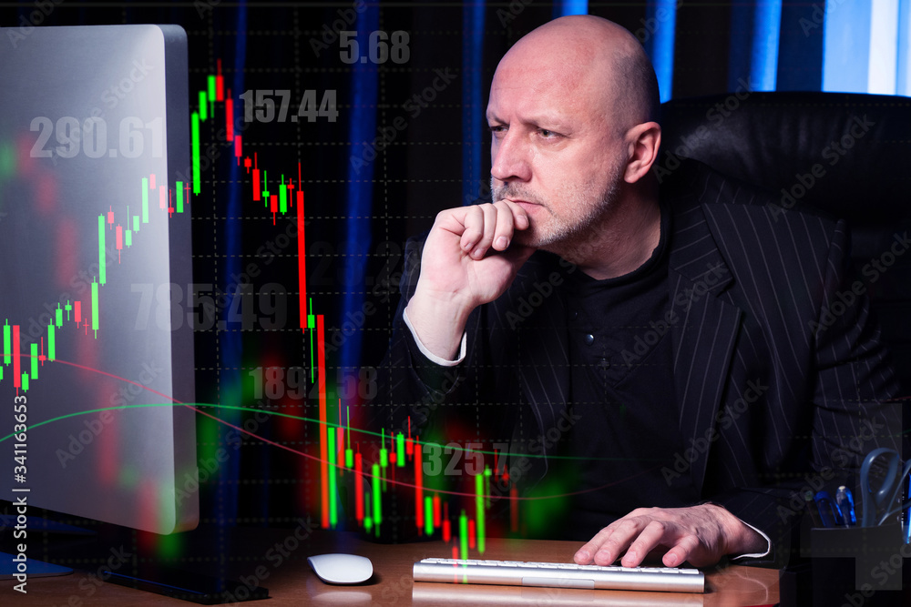 Poster stock exchange information and a focused person in front of a computer. remote participation in exch