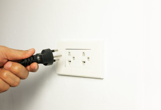 Man Unplug Power Cable Cord