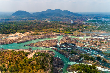 Fototapeta na wymiar Aerial view of Li Phi waterfall in Laos - Tat Somphamit, don khone, si phan don on four thousand islands in Laos. Landscape of nature in south east asia during summer.