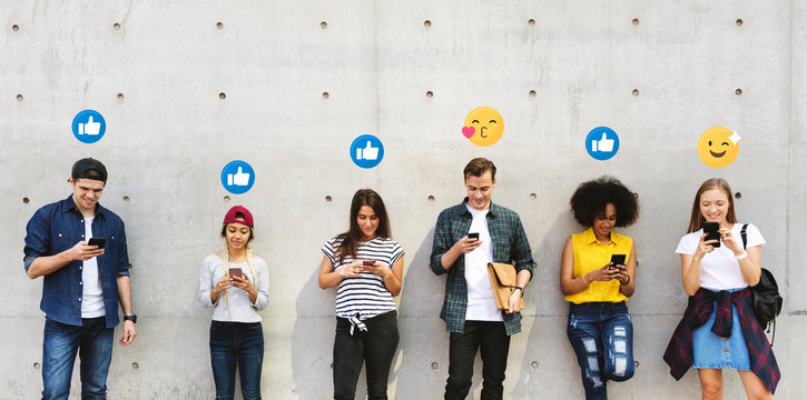 Happy teenagers addicted to their smartphones - Powered by Adobe