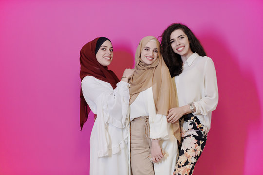 muslim women in fashionable dress isolated on pink