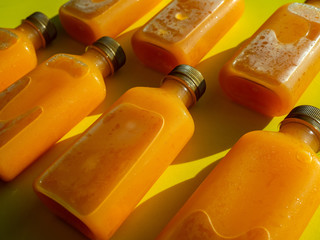 Orange juice iced cold in the bottles.