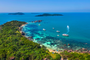 Aerial view of people swimming on the sea and beach on Gam Ghi Phu Quoc island in Thailand bay, Kien Giang, Vietnam.