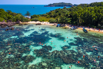 Aerial view of people swimming on the sea and beach on Gam Ghi Phu Quoc island in Thailand bay, Kien Giang, Vietnam.
