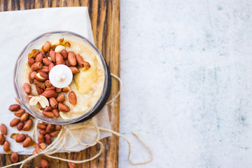 Grind and mix peanuts and banana puree in food processor, blender or mixer. Make vegan smooth sweet cream. Non diary food