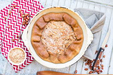 A piece of baked apple, nuts tart, pie or cake. Vegan sweet dessert on plate.