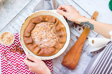 A piece of baked apple, nuts tart, pie or cake. Vegan sweet dessert on plate.