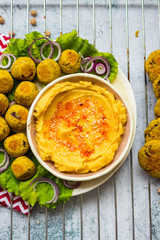 Baked chickpea falafel to eat with hummus, salad leaves and pita bread. Vegan healthy food.
