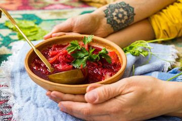Red borsch - homemade Russian traditional vegetables soup with cabbage, sauerkraut, beetroot and...