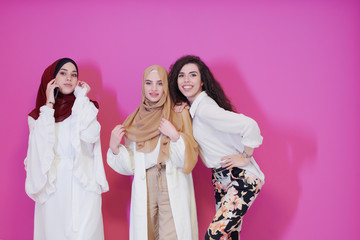 muslim women in fashionable dress isolated on pink
