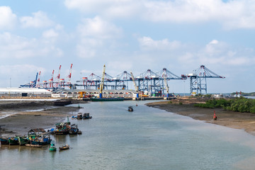 Fototapeta na wymiar Top view aerial of International container port Tan Cang - Cai Mep. Ba Ria, Vung Tau, Vietnam. Connect to Ho Chi Minh City by Thi Vai river and national road 51
