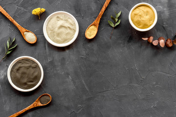 Clays set for face mask on black background top-down frame copy space