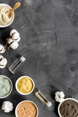 Clays set for face mask on black background top-down frame copy space