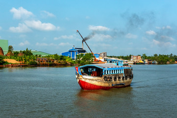 Boat transporting poultry on the Mekong River. Vinh Long, Vietnam, Mekong delta.