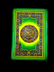 A photo of the Quran ready for Ramadan.  Arabic on the cover is translated as the Qur'an