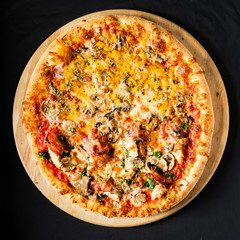 pizza on the black background