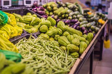 Fresh organic Vegetables and fruits on shelf in supermarket, farmers market. Healthy food. Vitamins and minerals. Tomatoes, capsicum, cucumbers, mushrooms, zucchini, Vegetables, Vegetables fresh