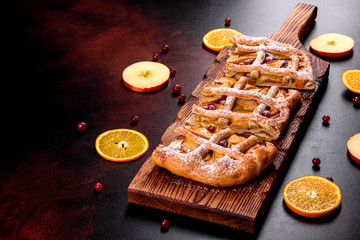 Delicious fresh pie baked with apple, pears and berries
