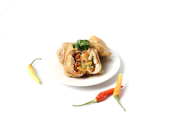 Deep fried stuffed tofu or called Tahu Isi traditional popular snack food isolated on white