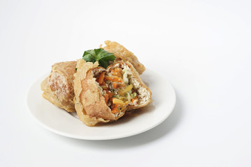 Deep fried stuffed tofu or called Tahu Isi traditional popular snack food isolated on white