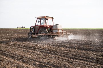 Fototapeta premium Agricultural sprayers, spray chemicals on field. spraying pesticides on field with sprayer